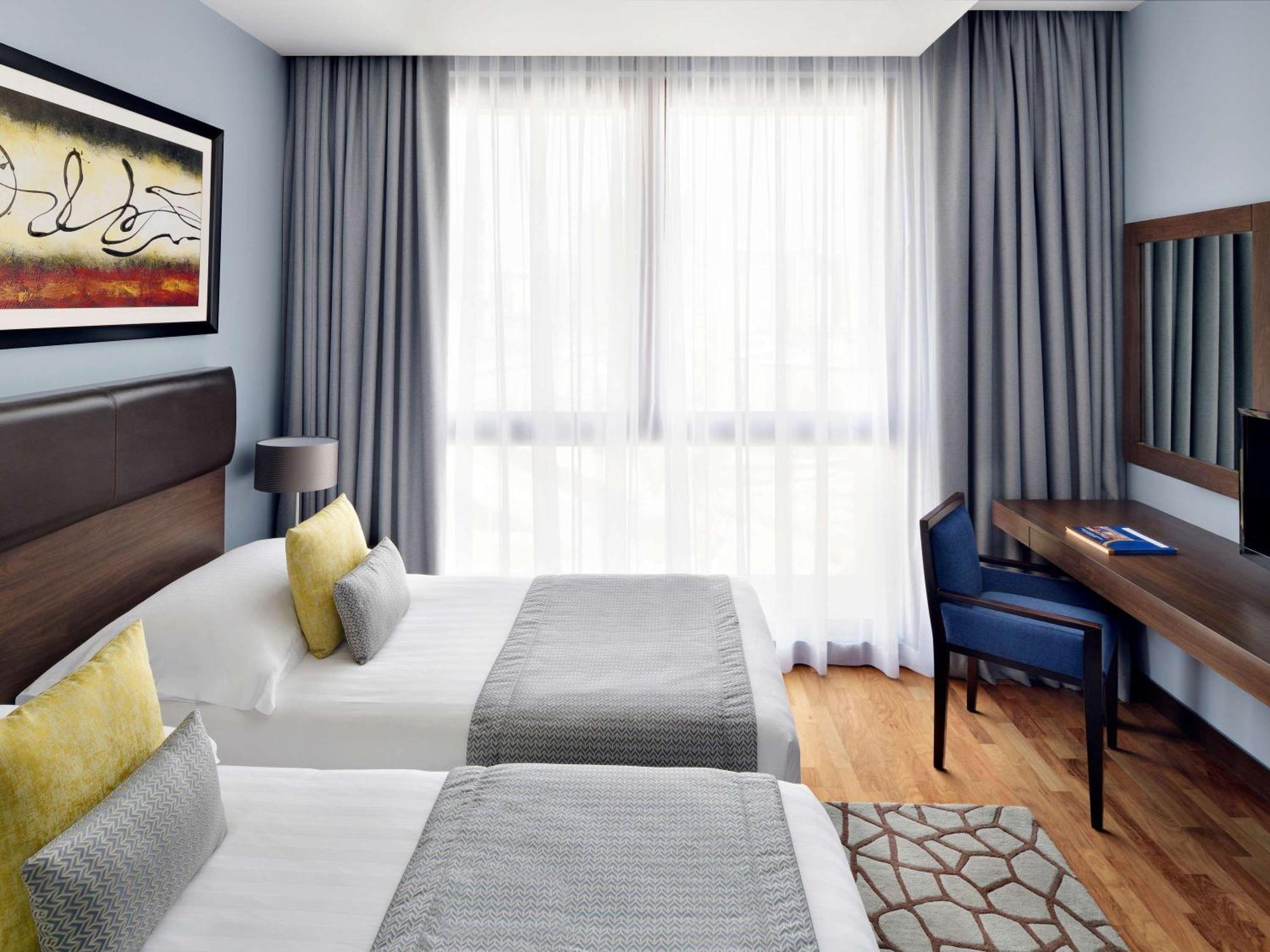 Moevenpick Hotel Apartments Al Mamzar Dubaj Exteriér fotografie A room at the hotel